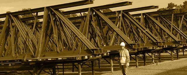 Roof joist girders ranging up to 128 feet in length and nearly 15 feet