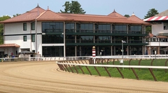 Exterior of the 3-story 1863 Club and outdoor racetrack