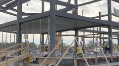 Construction of 1863 Club. Workers installing Deep-Dek® Composite on steel girders